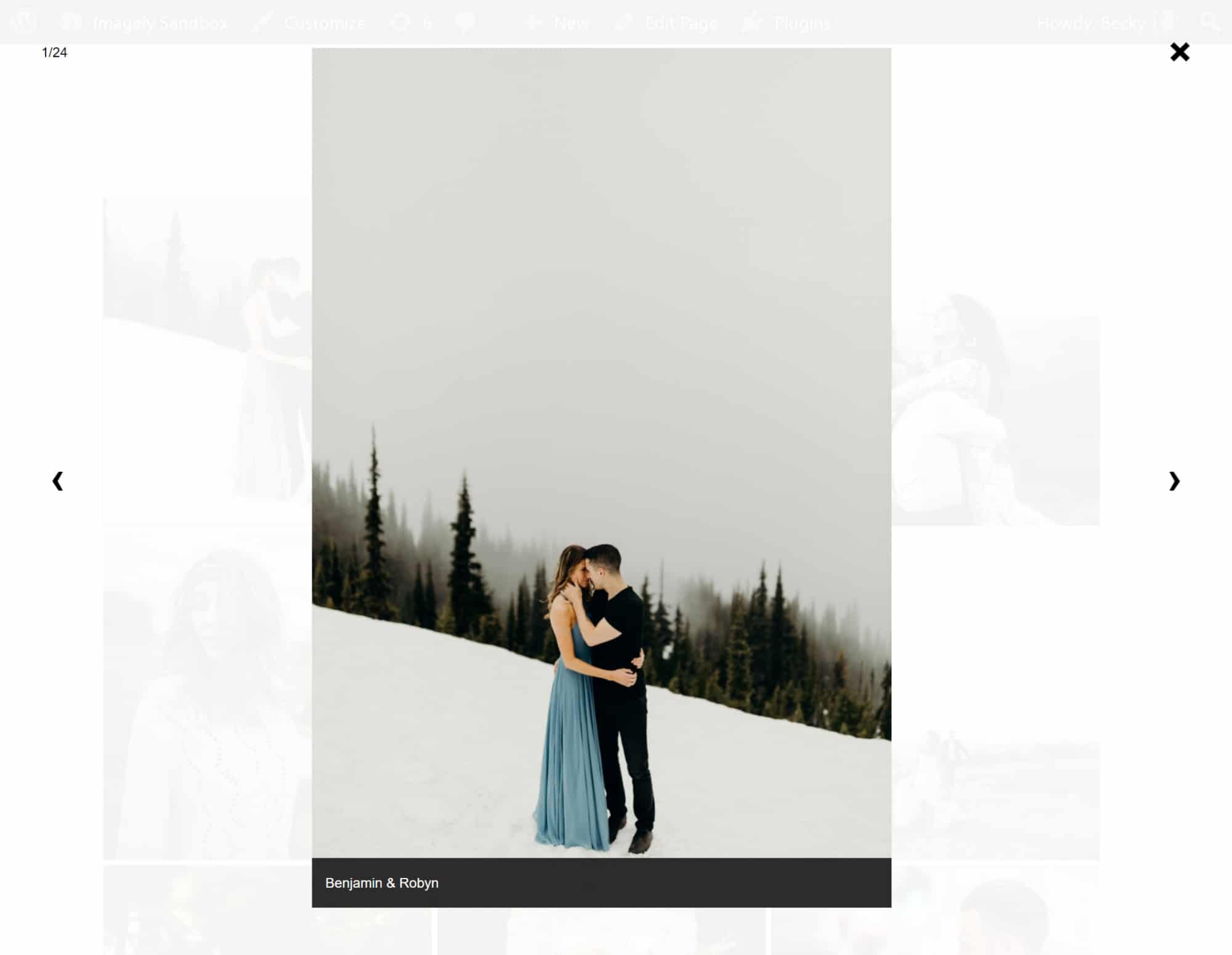 A screenshot of our Lightbox Effect showing the caption underneath, photo: a couple kissing in the snow