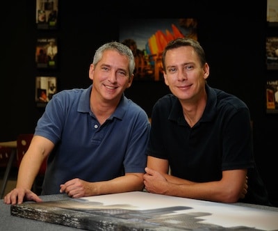 Photo of Lew Bedell & Bob Melson, founders of Artistic Photo Canvas, with Scott's photo of the Boston skyline.