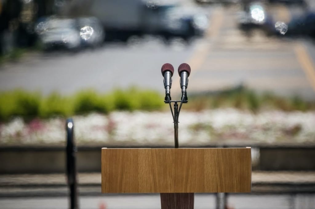 The objectively more important test image was the lectern at which Biden would later speak, and I thankfully intuited to spend more time working on that shot. Sadly, with the restricted space I had to shoot the image, the answer to how creative I could get with it was relatively little. Here is my test image for just the lectern: