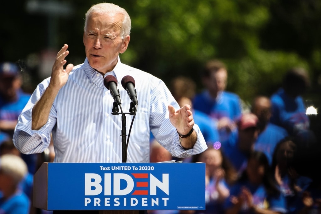 For these images, I found myself a spot a little further to the left of the stage, aiming to use the trees and the Biden supporters to create a more pleasing background, allowing the value of the highlights on Biden to draw the viewer into him. The division of the greens and blues of the background also creates a horizon-esque line, so it was important to keep it rather level and use it to draw towards my subject, rather than away from. 