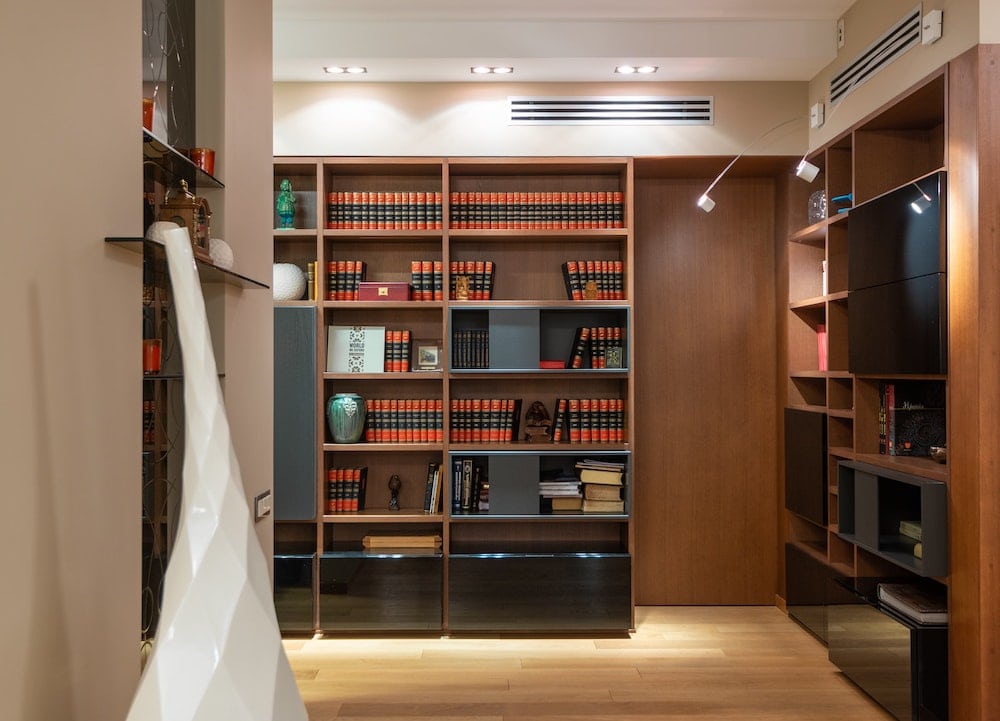 A set of organized bookshelves.