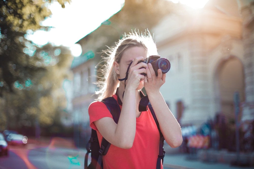 A woman taking a photograph.