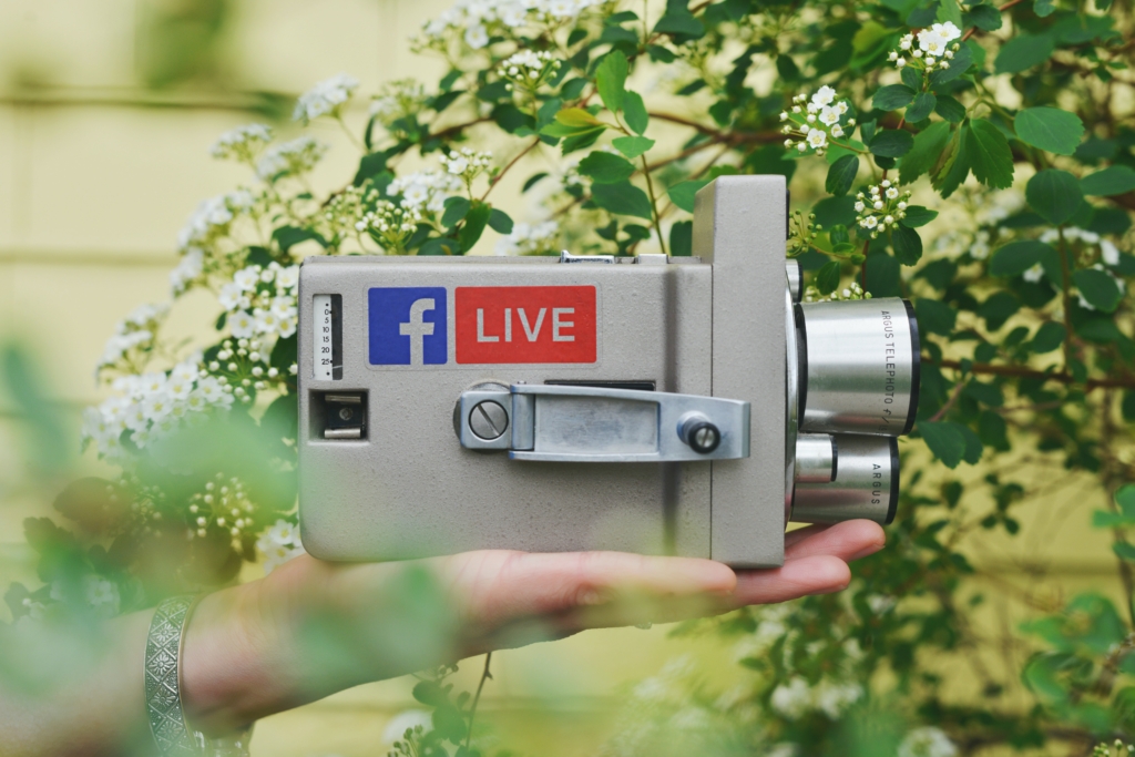 Live video | Imagely A close up shot of a person's hand holding a camcorder