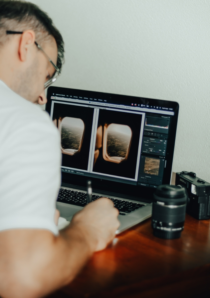 Over the shoulder shot of a person editing an image in Lightroom