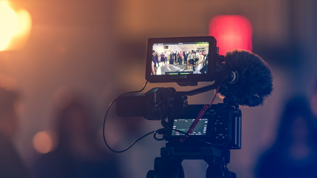 A camera screen displaying live streaming a wedding