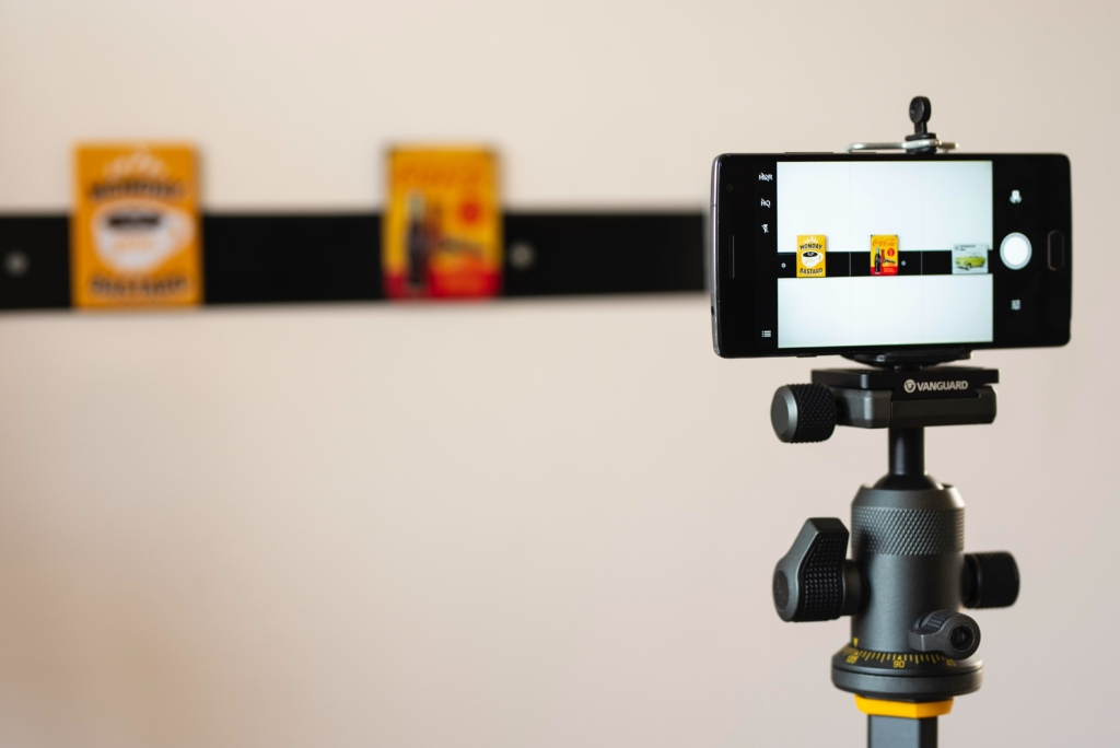 A smartphone mounted on a monopod